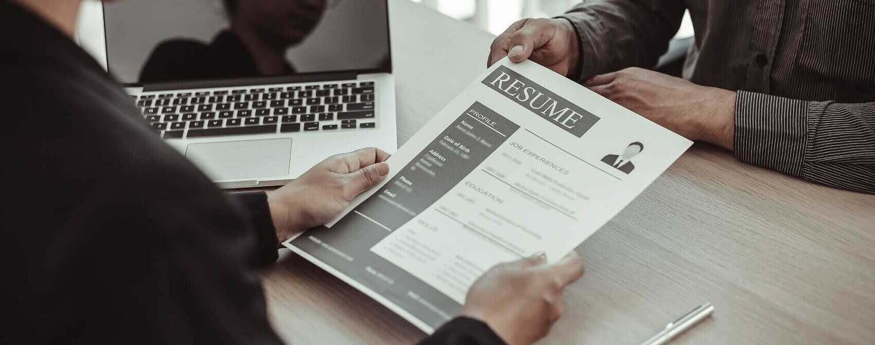 Somebody is giving a CV to someone Somebody is giving a CV to someone